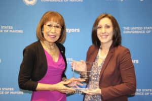 Angie Soety receives an award from Mayor Elizabeth Kautz