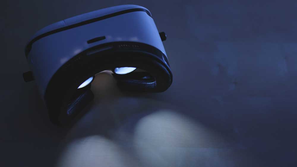 a VR headset illuminating light from the lenses